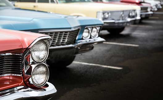 Classic cars lined up at vintage car show